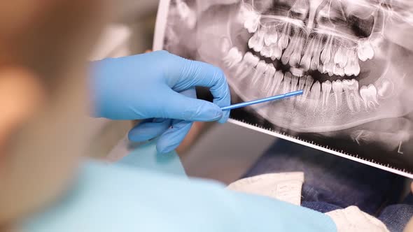 The child is afraid of the dentist, little boy visiting the dentist and looking scared