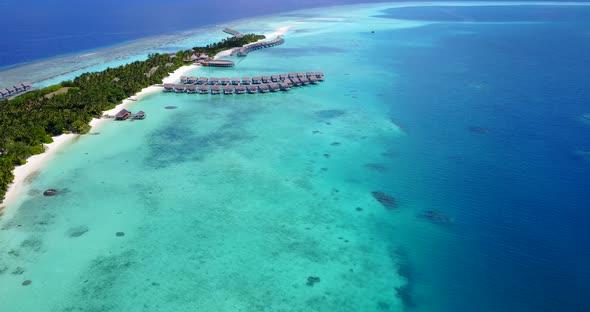 Luxury drone copy space shot of a white sandy paradise beach and blue ocean background in best quali