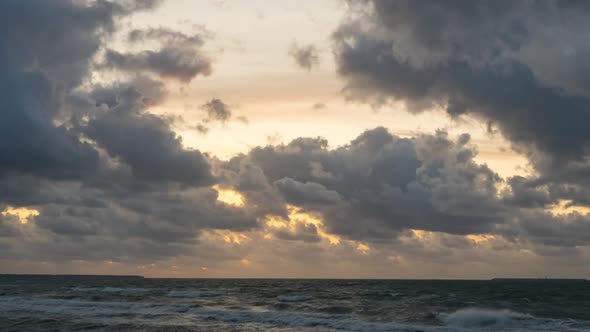 Golden sunset with dramatic cloudscape over the sea