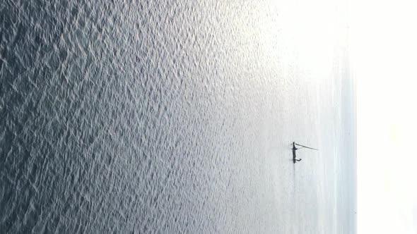 Vertical Video Boats in the Ocean Near the Coast of Zanzibar Tanzania Aerial View