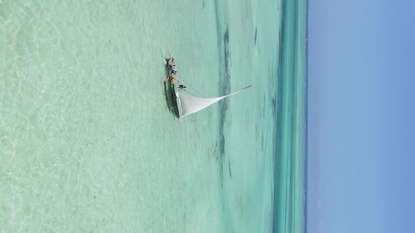 Vertical Video Boats in the Ocean Near the Coast of Zanzibar Tanzania Aerial View