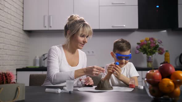 Mother and Son Preparing Reagents for Experiment