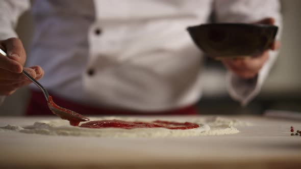 Chef Making Italian Pizza in Restaurant