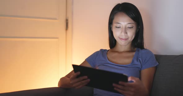 Woman use of tablet at home 