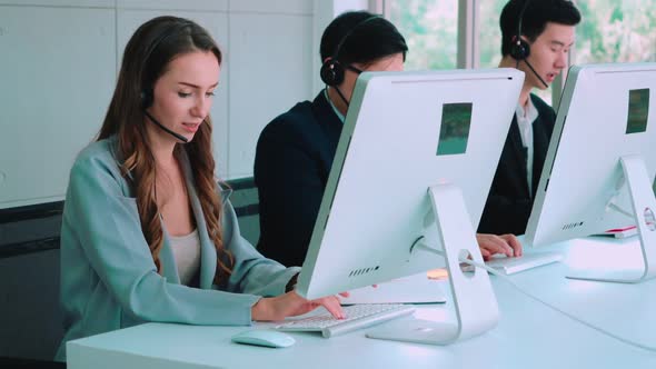 Business People Wearing Headset Working in Office