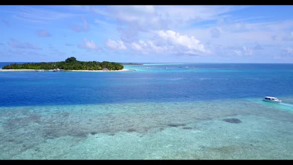 Aerial drone shot tourism of idyllic coast beach time by blue lagoon with white sandy background of 