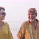 Senior couple walking on the beach and talking, steadicam shot - VideoHive Item for Sale