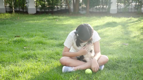 Happy Asian Children Playing With Siberian Husky Dog In The Garden Slow Motion