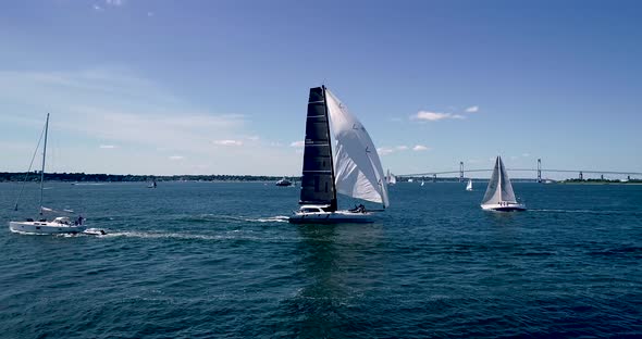 Sailboats entering and leaving Mt. Hope Bay in Newport Rhode Island as well as returning from Block