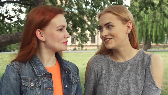 Two Girls Posing for a Camera