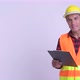 Young Happy Hispanic Man Construction Worker Presenting with Blackboard and Making Mistake - VideoHive Item for Sale