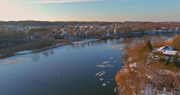 Aerial view residential houses covered snow with houses and roads at landscape