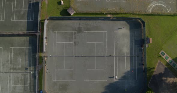 Top Down Aerial Pan of People Playing on Tennis Courts in Glen Head Long Island