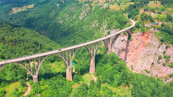 Panoramic Aerial View of the Djurdjevic Bridge Above Tara Blue River Montenegro