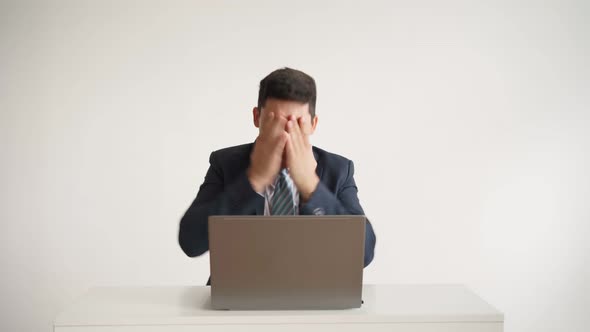 Happy Office Worker Works at Laptop and Funny Rejoices at Successful Deal