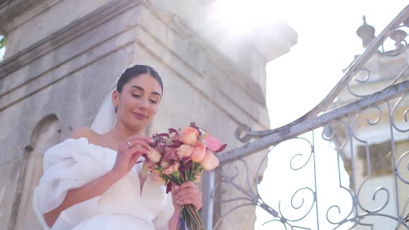 Bride Holds Beautiful Wedding Bouquet Before Her Face