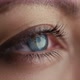 Close-up Shot of Woman Opening Blue Eyes - VideoHive Item for Sale