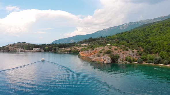 Aerial shot of Macedonia coast. Clif and beautiful water around Ohrid Lake in Southern Europe with b