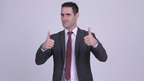 Happy Handsome Businessman Giving Two Thumbs Up