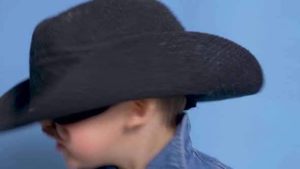 Cowboy Child with a Brown Mustache and a Hat
