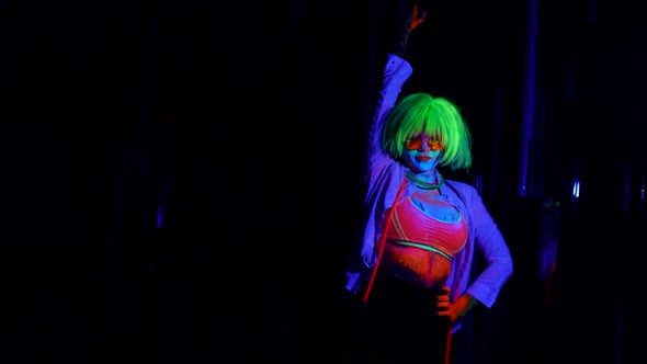 Gogo Dancer in Nightclub Dancing and Flirting Extravagant Image with Fluorescent Paints