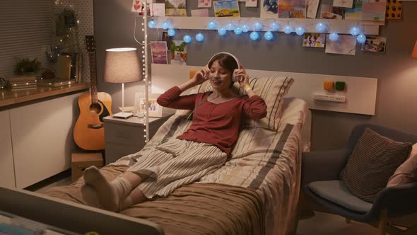 Girl Enjoying Music in Hospital Ward