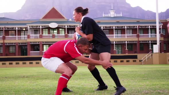 Male rugby players playing rugby in the stadium 4k