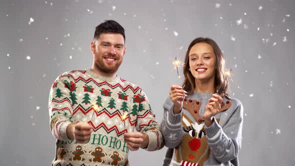 Happy Couple with Sparklers at Christmas Party