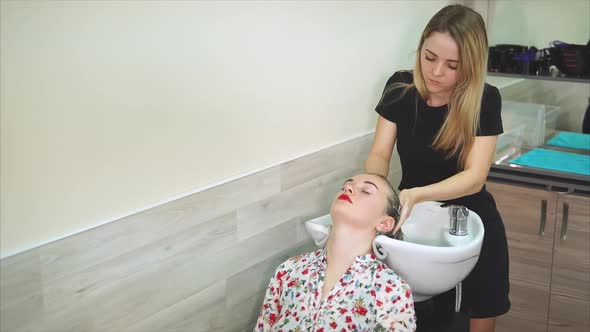 Women Getting a Hair Wash at the Beauty Salon