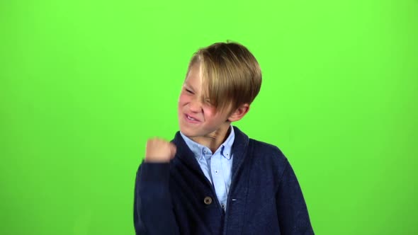 Child Rejoices in Victory. Green Screen. Slow Motion