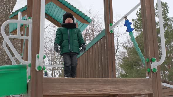 Little Boy on Winter Playground