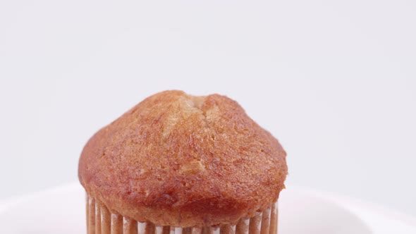 Muffins banana with white background shallow focus and slowly rotating.