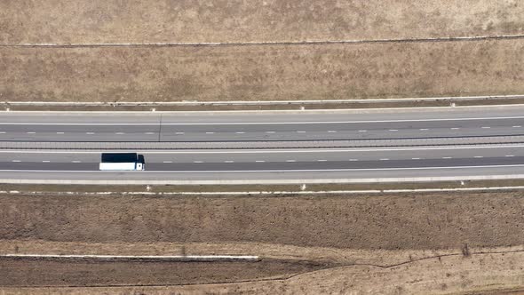 Cars and Trucks Passing on a Highway