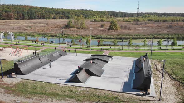 Urban skate park. Skateboarders in park.