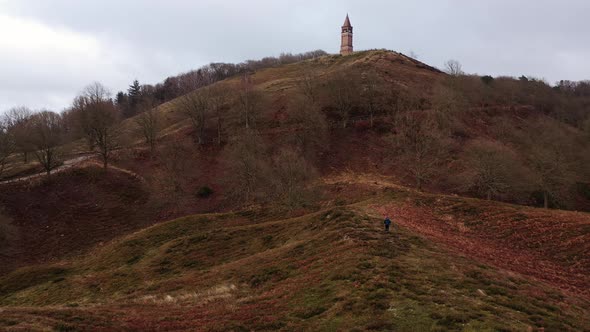 Aerial of a Tourist Hiking Along the Hills in Himmelbjerget Area Denmark