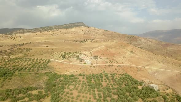 Aerial view of the small town in the mountainous highlands; sparse population in the highlands.