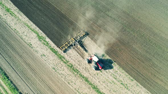 Plowing Machine Works on Farmland, Aerial View.