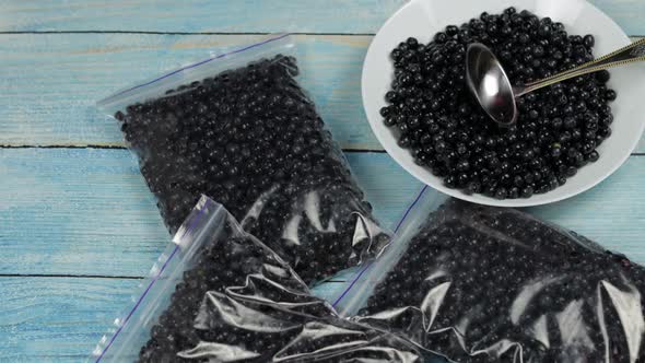 Packages with Blueberries in Zipper Plastic Bags for Freezing. Frozen, Preservation Berries Food