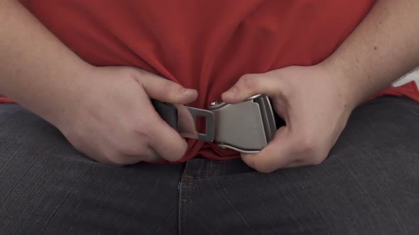 Chubby Man Hardly Fastening Seat Belt on Enormous Abdomen, Means of Precaution