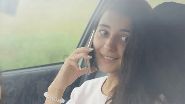 Beautiful Girl Talking on the Phone and Smiling