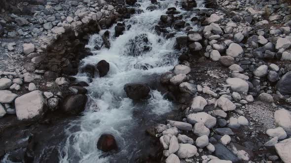 Drone Flight Over the River Flowing From the Slopes of Elbrus