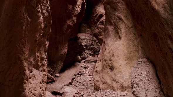 Drone Flying Through Narrow Canyon in Mountains