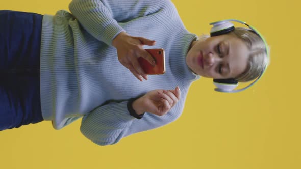 Woman Dancing and Listening Music