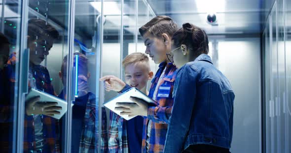 Kids with Digital Pad in Server Room