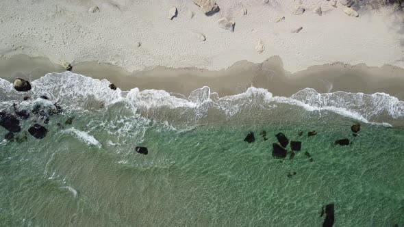 Aerial View of Sandy Beach and Sea Waves