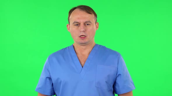 Medical Man Refuses Stress and Takes Situation, Calms Down, Breathes Deeply. Green Screen