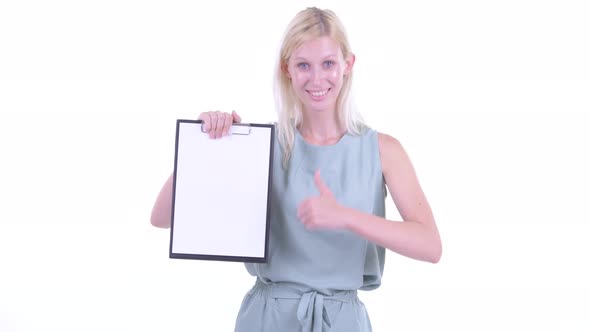 Happy Young Blonde Woman Showing Clipboard and Giving Thumbs Up