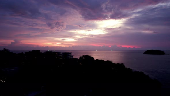 Purple Sunset with a View of the Sea and Clouds