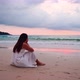 Young woman feeling lonely and sad looking at the sea on a gloomy day - VideoHive Item for Sale