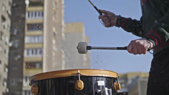 Water is Poured Onto the Drum and Sprayed Out